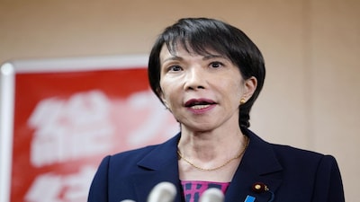 Japan's Liberal Democratic Party newly elected chief Sanae Takaichi speaks to media after a meeting with Japan's Komeito party leader Tetsuo Saito, at the party headquarters, in Tokyo, Japan October 10, 2025, in this photo taken by Kyodo. Kyodo/via REUTERS