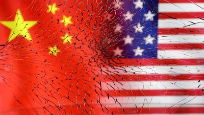 FILE PHOTO: U.S. and Chinese flags are seen through broken glass in this illustration created on January 30, 2023. REUTERS/Dado Ruvic/Illustration//File Photo