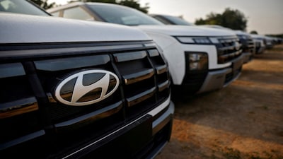 FILE PHOTO: The logo of Hyundai Motor India Limited is seen on a parked car in the company's stockyard, in the outskirts of Ahmedabad, India, October 8, 2024. REUTERS/Amit Dave/File Photo