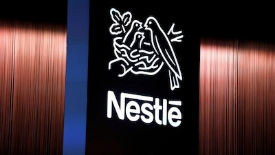 FILE PHOTO: The Nestle logo is seen during the opening of the 151st Annual General Meeting of Nestle in Lausanne, Switzerland April 12, 2018. REUTERS/Pierre Albouy//File Photo