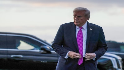 President Donald Trump arrives at West Palm Beach International Airport on Oct. 17.