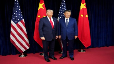 Donald Trump and Chinese President Xi Jinping pose for photos ahead of a bilateral meeting in South Korea