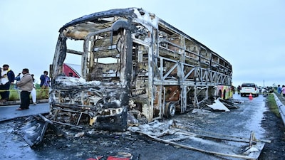 Kurnool: Charred remains of a Hyderabad-bound private bus that caught fire after a collision with a two-wheeler, near Chinnatekur in Kurnool district, Andhra Pradesh, Friday, Oct. 24, 2025. At least 12 people were killed in the accident. (PTI Photo)(PTI10_24_2025_000003B)