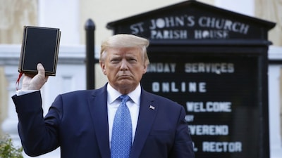 FILE - President Donald Trump holds a Bible as he visits outside St. John's Church across Lafayette Park from the White House, June 1, 2020, in Washington.  Trump is now selling Bibles as he runs to return to the White House. The presumptive Republican nominee released a video on his Truth Social platform Tuesday urging his supporters to purchase the “God Bless The USA Bible." (AP Photo/Patrick Semansky, File)