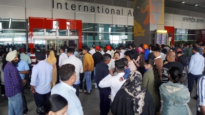 People wait outside the arrivals� exit at the Indira Gandhi International (IGI) Airport, in New Delhi, in New Delhi, Friday, Nov. 7, 2025. Airports Authority of India (AAI) on Friday said flight operations at the Delhi airport are facing delays due to a technical issue in the Automatic Message Switching System (AMSS), which supports air traffic control data. (PTI Photo) 