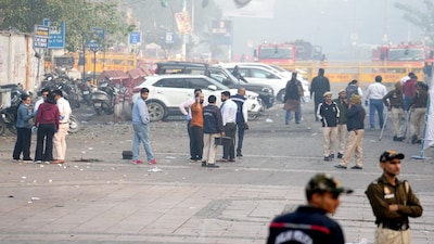 New Delhi: Security officials at the site in view of the blast that occurred near Red Fort Metro Station on Monday, killing at least nine people and gutting several vehicles, in New Delhi, Tuesday, Nov. 11, 2025. (PTI Photo/Kamal Kishore)(PTI11_11_2025_000014B)