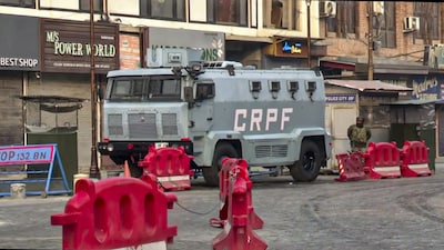 **EDS: SCREENSHOT VIA PTI VIDEOS** Srinagar: A security official stands near a CRPF vehicle amid high alert following a blast near Delhi's Red Fort metro station on Monday, in Srinagar, Tuesday, Nov. 11, 2025. (PTI Photo) (PTI11_11_2025_000227B)