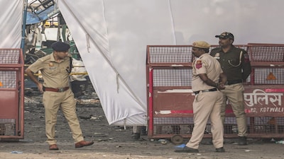New Delhi: Police personnel at the cordoned off area in view of the blast that occurred near Red Fort Metro Station on Monday, killing 12 people and gutting several vehicles, in New Delhi, Tuesday, Nov. 11, 2025. (PTI Photo/Kamal Kishore)(PTI11_11_2025_000242B)