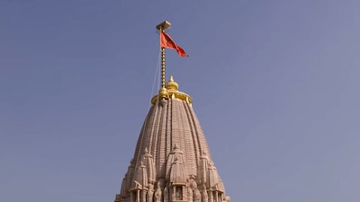 **EDS: THIRD PARTY IMAGE** In this screenshot from a video posted on Nov. 25, 2025, A saffron flag being ceremonially hoisted by Prime Minister Narendra Modi, unseen, atop the Ram temple during a ceremony, in Ayodhya, Uttar Pradesh. (@NarendraModi/YT via PTI Photo)(PTI11_25_2025_000125B)