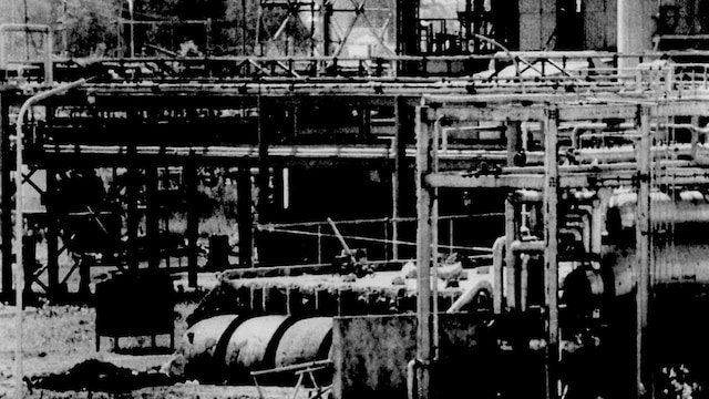 The underground three-flanged stainless steel tank (lower left foreground) at Union Carbide's Bhopal factory from which poison gas leaked last December, killing 2,500. The tank, seen here for the first time since the disaster, has been uncovered by officials probing the tragedy on March 18, 1985. REUTERS