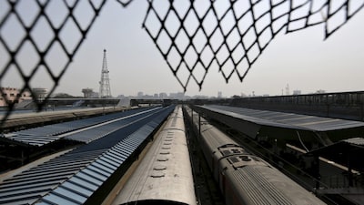 Passenger trains are seen parked at platforms at a railway station in New Delhi, India, February 25, 2016. India's state-owned railway said on Thursday it planned to cut costs and generate new sources of revenue next year to offset a big rise in its wage bill and help keep an ambitious modernisation plan on track on track.   REUTERS/Anindito Mukherjee