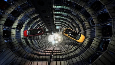 Volkswagen ID.7 GTX Tourer electric cars and Volkswagen T-Roc vehicles are loaded into a delivery tower at the German carmaker's plant in Wolfsburg, Germany, November 21, 2025. REUTERS/Annegret Hilse