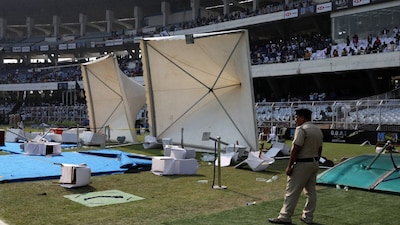 Soccer Football - Argentine soccer star Lionel Messi on a whirlwind tour of India - Vivekananda Yuva Bharati Krirangan, Kolkata, India - December 13, 2025 Plastic water bottles and chairs are seen scattered on the field after Argentine soccer star Lionel Messi leaves the stadium REUTERS/Sahiba Chawdhary