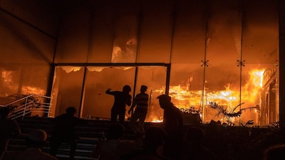 A group of people set fire to The Daily Star newspaper office building following the death of Sharif Osman Hadi, a student leader who had been receiving treatment in Singapore after being shot in the head, in Dhaka, Bangladesh, December 19, 2025. REUTERS/Abdul Goni