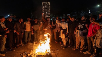 People shout slogans following the death of Sharif Osman Hadi, a student leader who had been receiving treatment in Singapore after being shot in the head, in Dhaka, Bangladesh, December 18, 2025. REUTERS/Abdul Goni