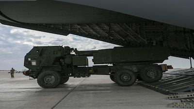 A U.S. Army M142 High Mobility Artillery Rocket System loads onto a U.S. Air Force C-17 Globemaster III aircraft within the U.S. Central Command area of responsibility, December 19, 2025, in support of Operation Hawkeye Strike as the U.S. military launched large-scale strikes against dozens of Islamic State targets in Syria in retaliation for an attack on U.S. personnel, U.S. officials said.  U.S. Air Force Photo/Handout via REUTERS THIS IMAGE HAS BEEN SUPPLIED BY A THIRD PARTY