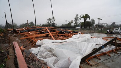 The foundation of a house under construction is covered with plastic sheets to protect it from heavy rains brought by an atmospheric river in Altadena, California, U.S., December 24, 2025. REUTERS/Arafat Barbakh