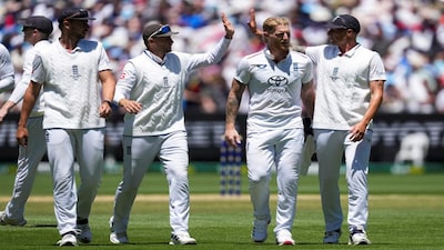 Cricket - The Ashes - Australia v England - Fourth Test - MCG, Melbourne, Australia - December 27, 2025 England's Josh Tongue, Joe Root, Ben Stokes and Brydon Carse celebrate after taking the final wicket of Australia's 2nd innings REUTERS/Asanka Brendon Ratnayake