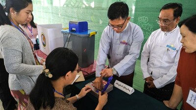 Election Commission officials prepare at a polling station inside a school ahead of a general election, in Thingangyun Township, Yangon, Myanmar, December 27, 2025. REUTERS