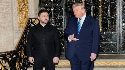 U.S. President Donald Trump speaks next to Ukrainian President Volodymyr Zelenskiy upon his arrival for meetings at Trump's Mar-a-Lago club in Palm Beach, Florida, U.S., December 28, 2025. REUTERS/Jonathan Ernst