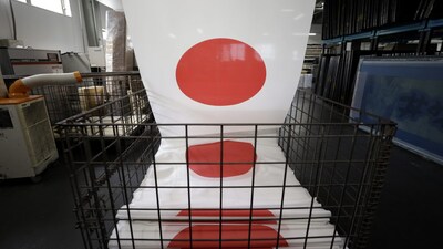 Japanese national flags stacked in a cart during the printing at Hattori Co.'s factory in Miyoshi, Aichi Prefecture, Japan, on Tuesday, June 29, 2021.  Photographer: Kiyoshi Ota/Bloomberg