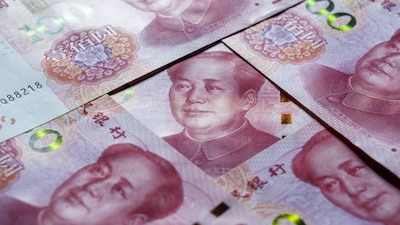 Chinese Yuan banknotes arranged for a photograph in Shanghai, China, on Tuesday, Dec. 7, 2025.