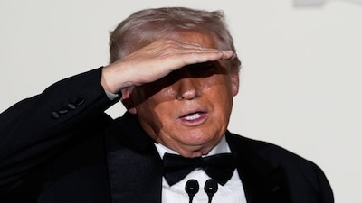 President Donald Trump looks into the crowd as he speaks in the Grand Foyer of the White House during the Congressional Ball, Thursday, Dec. 11, 2025, in Washington. (AP Photo/Alex Brandon)