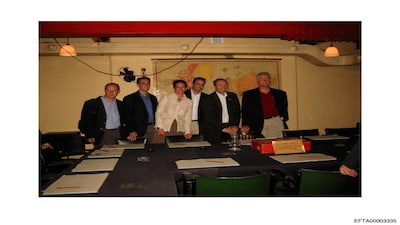 This undated photo released by the U.S. Department of Justice shows Ghislaine Maxwell, third from left, actor Kevin Spacey, second from right, and former President Bill Clinton, far right, with a group of unknown people. (U.S. Department of Justice via AP)