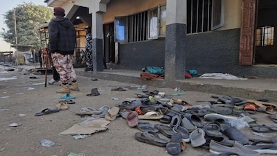 Flip-flops belonging to worshippers are seen following a deadly bomb explosion at a mosque in Maiduguri, Nigeria, Thursday, Dec. 25, 2025. (AP Photo/Jossy Ola)