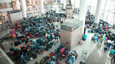 Luggage of passengers piled up at the Indira Gandhi International Airport amid IndiGo flight disruptions, in New Delhi. (PTI)