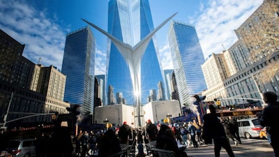 People walk around the Financial District near the New York Stock Exchange (Reuters)