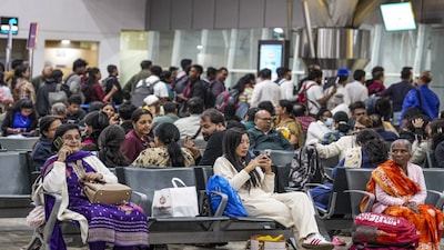 Raipur: Passengers wait at Swami Vivekananda Airport amid flight disruptions, in Raipur, Chhattisgarh, Thursday, Dec. 4, 2025. IndiGo on Thursday cancelled more than 300 domestic and international flights at Delhi, Mumbai, Bangalore, and other airports, as operational disruptions continued for the third day, impacting the travel plans of hundreds of passengers. (PTI Photo/Kunal Patil)(PTI12_04_2025_000423B)