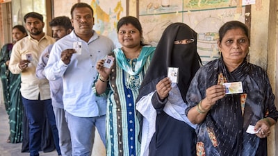Karad: Voters wait in queues to cast their votes during the Municipal Council elections at a polling station , in Karad, Maharashtra, Saturday, Dec. 20, 2025. (PTI Photo)(PTI12_20_2025_000169B)