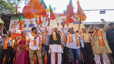 Mumbai: BJP Maharashtra President Ravindra Chavan, third right, and party leaders celebrate victory in the Maharashtra local body elections, at the BJP head office, in Mumbai, Sunday, Dec. 21, 2025. (PTI Photo)(PTI12_21_2025_000267B)