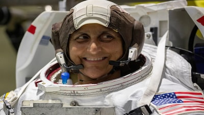 NASA Commercial Crew astronaut Sunita Williams smiles as she wears her space suit at NASA's Neutral Buoyancy Laboratory (NBL) training facility near the Johnson Space Center in Houston, Texas, U.S., July 1,2019.  Picture taken July 1, 2019.   REUTERS/Mike Blake