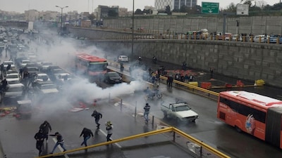 Riot police tries to disperse people as they protest on a highway against increased gas price in Tehran, Iran November 16, 2019. Nazanin Tabatabaee/WANA (West Asia News Agency) via REUTERS ATTENTION EDITORS - THIS IMAGE HAS BEEN SUPPLIED BY A THIRD PARTY