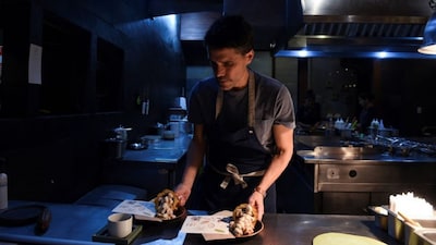Head Chef and owner of Peruvian restaurant Central Virgilio Martinez, prepares a dish created by him and Marsia Taha, Chef of Bolivian restaurant Gustu, with ingredients from the Amazon, at restaurant Gustu, in La Paz, Bolivia March 31, 2023. REUTERS/Claudia Morales