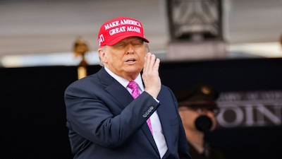 U.S. President Donald Trump wears a 'Make America Great Again' (MAGA) hat as he attends the commencement ceremony at West Point Military Academy in West Point, New York, U.S., May 24, 2025. REUTERS/Eduardo Munoz