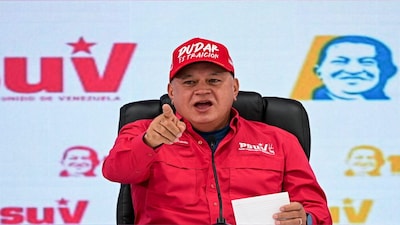Venezuela's Interior Minister Diosdado Cabello, wearing a hat reading: "To doubt is treason", speaks during a press conference, in Caracas, Venezuela, September 29, 2025. REUTERS/Gaby Oraa