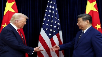 U.S. President Donald Trump shakes hands with Chinese President Xi Jinping as they hold a bilateral meeting at Gimhae International Airport, on the sidelines of the Asia-Pacific Economic Cooperation (APEC) summit, in Busan, South Korea, October 30, 2025. REUTERS/Evelyn Hockstein