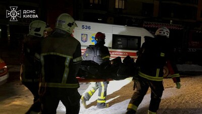 Firefighters carry the body of a person found under debris of a private hospital damaged during Russian drone and missile strikes, amid Russia's attack on Ukraine, in Kyiv, Ukraine January 5, 2026. Press service of the State Emergency Service of Ukraine in Kyiv/Handout via REUTERS ATTENTION EDITORS - THIS IMAGE HAS BEEN SUPPLIED BY A THIRD PARTY. DO NOT OBSCURE LOGO.