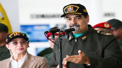 Venezuela’s President Nicolas Maduro and his wife Cilia Flores attend a year-end salutation to military forces in La Guaira, Venezuela December 28, 2025. Miraflores Palace/Handout via REUTERS