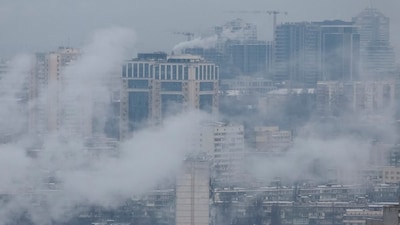Water vapour rises from residential buildings' autonomous heating systems during a power blackout and freezing temperatures, after critical civil infrastructure was hit by recent Russian missile and drone attacks, amid Russia's attack on Ukraine, in Kyiv, Ukraine January 13, 2026. REUTERS/Gleb Garanich