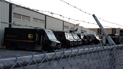 FILE PHOTO: United Parcel Service (UPS) vehicles are seen at a facility in Brooklyn, New York City, U.S., May 9, 2022. REUTERS/Andrew Kelly/File Photo
