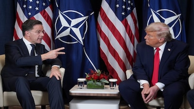 President Donald Trump, right, meets with NATO Secretary General Mark Rutte during a meeting on the sidelines of the Annual Meeting of the World Economic Forum in Davos, Switzerland, Wednesday, Jan. 21, 2026. (AP Photo/Evan Vucci)