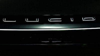 FILE PHOTO: The LUCID logo is shown on their electric Gravity vehicle at the LA Auto show "AutoMobility LA" in Los Angeles, California, U.S. November 20, 2025.  REUTERS/Mike Blake/File Photo
