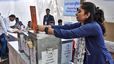 Thane: A government employee casts vote at a polling centre through postal ballot facility organised police and government employees deployed for the upcoming Mumbai civic body elections, in Thane, Saturday, Jan. 10, 2026. (PTI Photo)