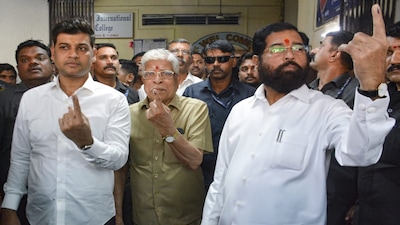 Thane: Maharashtra Deputy Chief Minister Eknath Shinde displays his inked finger after casting his vote with family members at a polling station during the Thane Municipal Corporation general elections, in Thane, Thursday, January 15, 2026. (PTI Photo)(PTI01_15_2026_000278B)