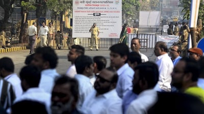 Security personnel keep vigil outside a centre during counting of votes for the Navi Mumbai Municipal Corporation election, at Vashi, in Navi Mumbai, Friday, Jan. 16, 2026. (PTI Photo)