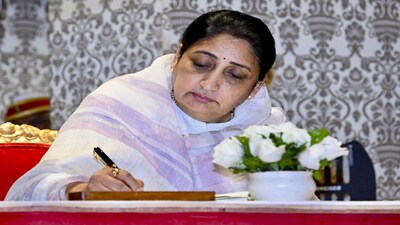 **EDS: THIRD PARTY IMAGE** In this image posted on Jan. 31, 2026, Rajya Sabha MP Sunetra Pawar, wife of late NCP chief Ajit Pawar, signs documents after taking oath as Maharashtra's first woman Deputy Chief Minister during a ceremony at Lok Bhavan, in Mumbai. (@CMOMaharashtra/X via PTI Photo) (PTI01_31_2026_000403B)